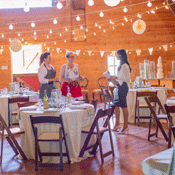 Three women standing and talking in a room