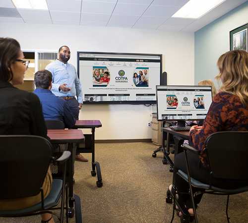 Male CDTFA Employee Presenting to a Group of Male and Female Taxpayers